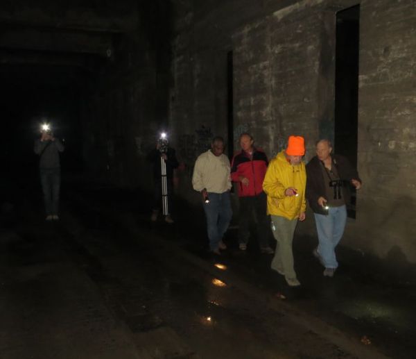 APTA tour group walking through darkness of Cincinnati's never-finished subway on morning of Dec. 14th. (Photo: L. Henry.)